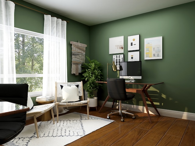 A living room/office area, maximizing functionality, with natural light streaming in.
