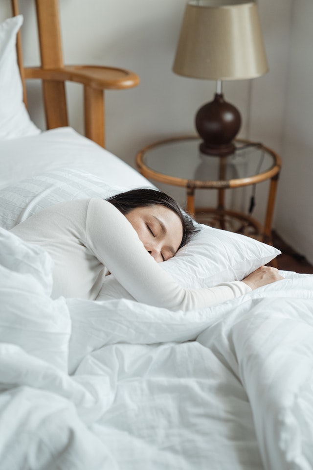 Woman sleeping soundly on the bed