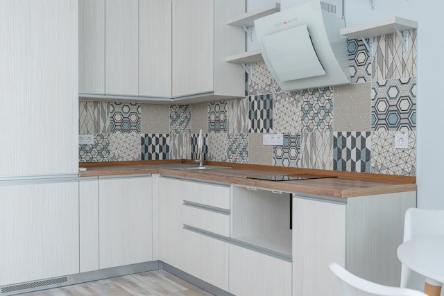 Kitchen in cream palette with printed accent wall